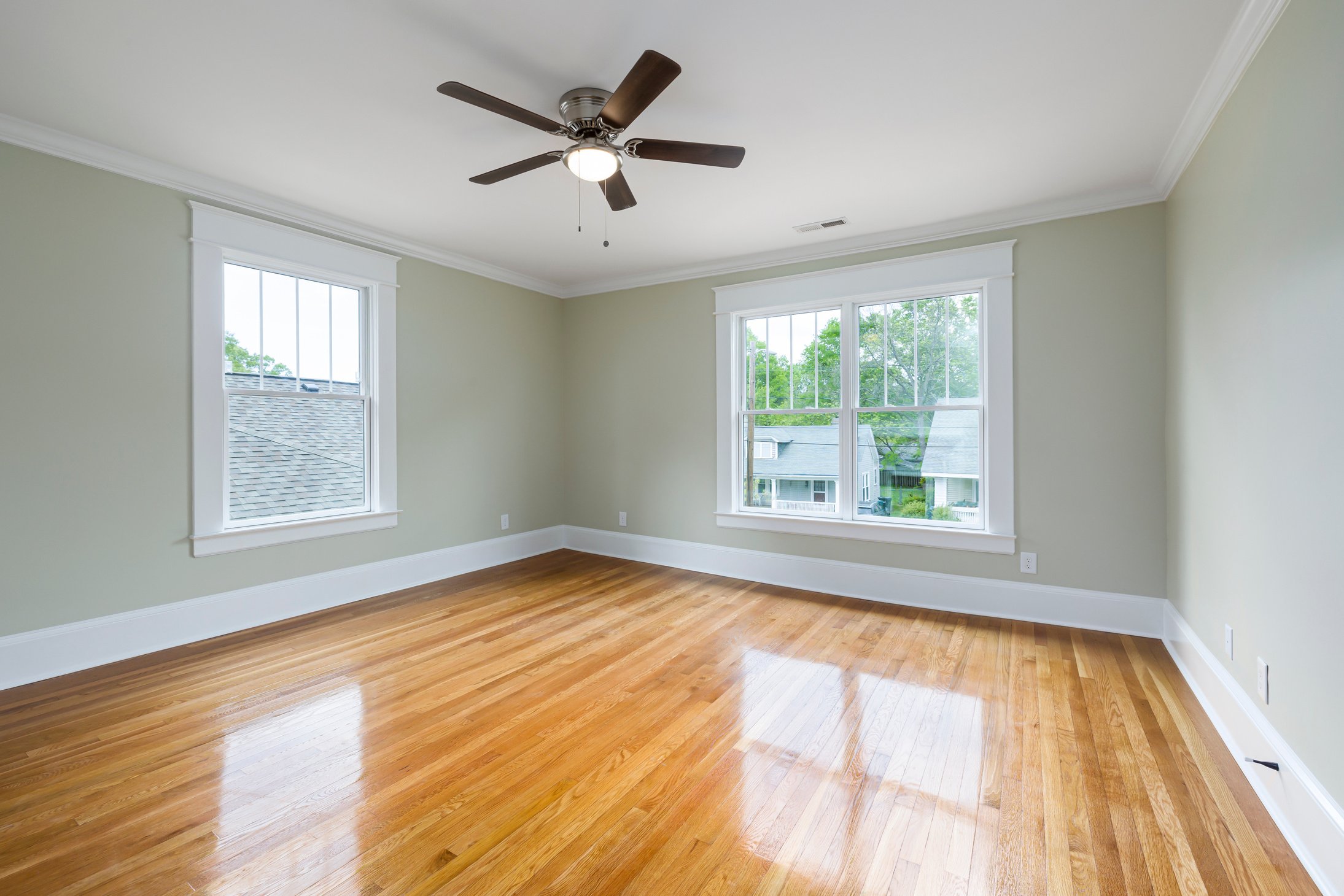 An Empty Living Room with Ceiling Fan